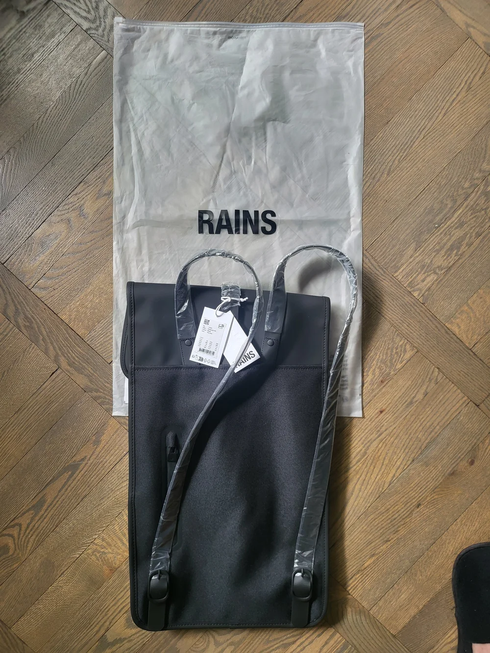 Rains Black Minimalist Backpack withTag